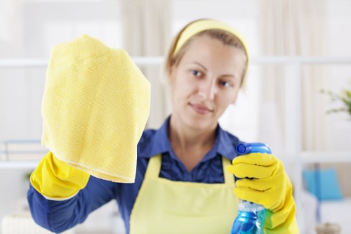 Carpet cleaning team preparing equipment with safety focus